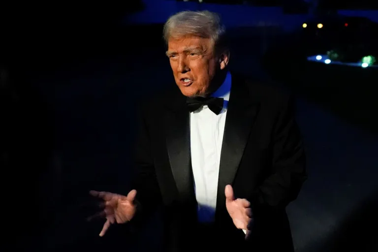 Trump speaks to reporters before heading to an annual dinner event.