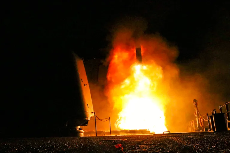 In this image provided by the U.S. Navy, the guided-missile cruiser USS Monterey (CG 61) fires a Tomahawk land attack missile Saturday, April 14, 2018, as part of the military response to Syria's use of chemical weapons on April 7. The United States, France and Britain launched military strikes in Syria to punish President Bashar Assad for an apparent chemical attack against civilians and to deter him from doing it again.