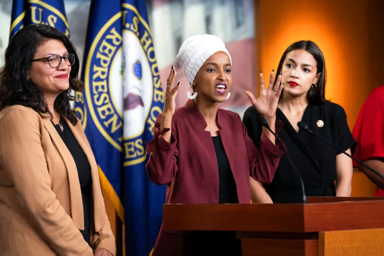 U.S. Rep. Ilhan Omar, D-Minn., flanked by U.S. Rep. Rashida Tlaib, D-Mich., left, and U.S. Rep. Alexandria Ocasio-Cortez, D-N.Y., responds to remarks by President Donald Trump after he called for four Democratic congresswomen of color to go back to their 