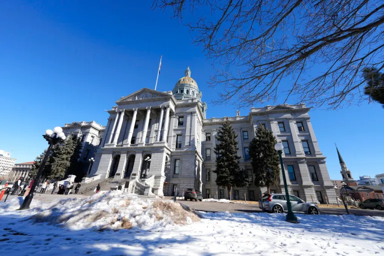 In this Monday, Jan. 10, 2022, file photograph, the Colorado State Capitol is shown in Denver. The partisan divide over how to confront escalating street crime came to the fore on Thursday, March 3, 2022, in the statehouse as a Colorado legislative panel advanced a Democrat-sponsored bill designed to let local communities use state grants for neighborhood improvements in high-crime areas.