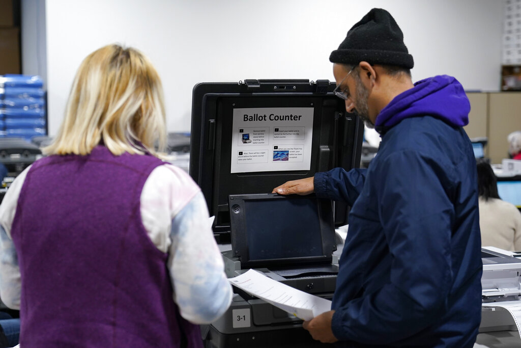 Chairman of major voting machine firm faces criticism for partisan political donations