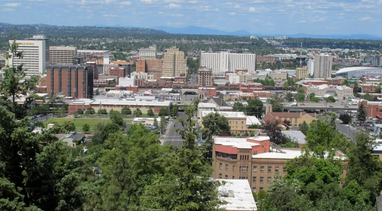 The downtown skyline is shown from the South Hill in Spokane, Wash., on June 4, 2018. The American Civil Liberties Union of Washington has sued the city of Spokane, alleging that its anti-homeless laws violate the state constitution. The group filed the suit on Thursday, Aug. 1, 2024, on behalf of a currently homeless person and someone who was formerly homeless.