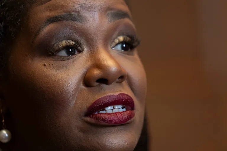 Former Rep. Cori Bush (D-MO) talks to a reporter.