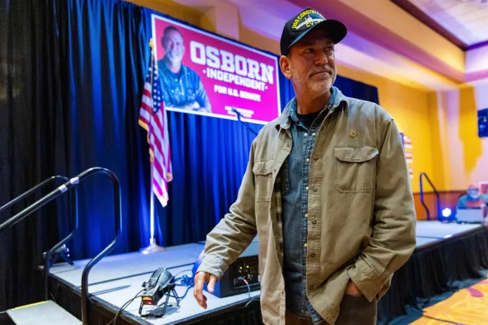 Independent Nebraska Senate candidate Dan Osborn departs an election night watch party at the Embassy Suites by Hilton Omaha La Vista Hotel & Conference Center in La Vista, Neb., Tuesday, Nov. 5, 2024.