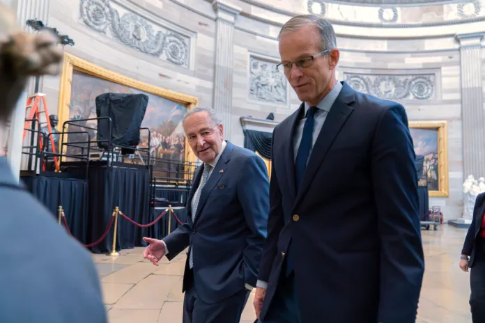 Senate Minority Leader Chuck Schumer (D-NY) and Senate Majority Leader John Thune (R-SD) lead a Senate procession through the Capitol Rotunda.