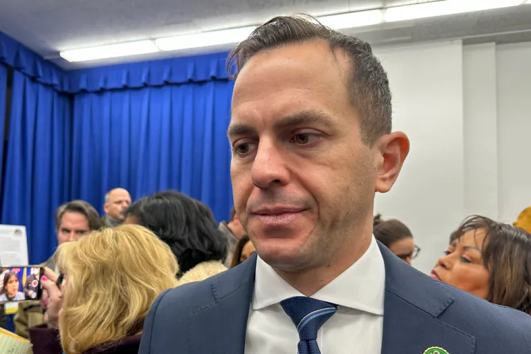 Rob Menendez stands at an event for a picture