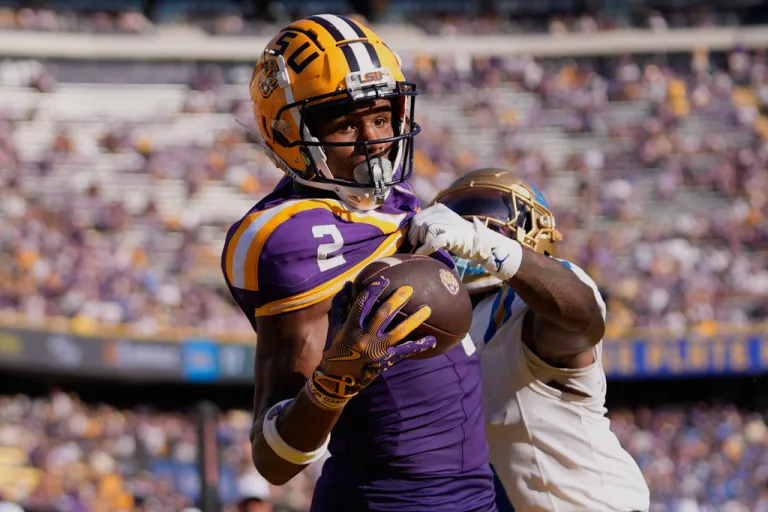 SU wide receiver Kyren Lacy (2) tries to pull in a pass in the end zone as he is covered by UCLA defensive back Jaylin Davies in the second half of an NCAA college football game in Baton Rouge, La., Saturday, Sept. 21, 2024.