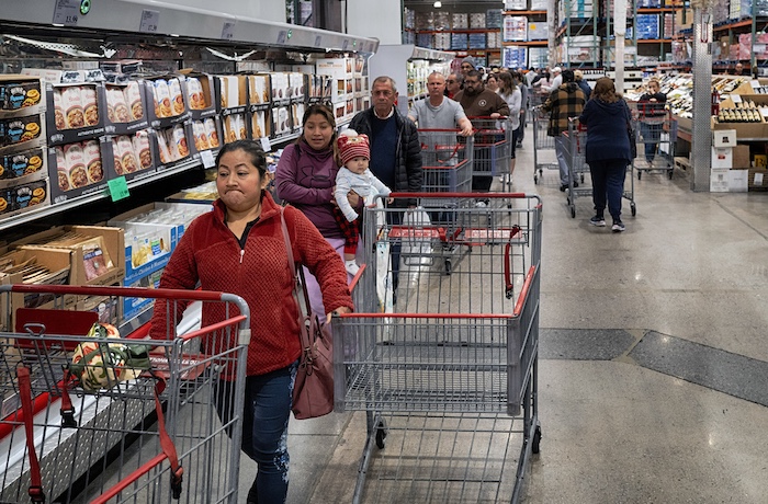 FILE - Customers wait in line for eggs at a Costco store in the Van Nuys section of Los Angeles on Wednesday, Feb. 19, 2025.