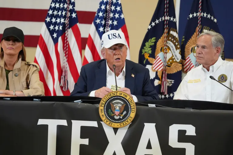 President Donald Trump speaks as first lady Melania Trump, left, and Texas Gov. Greg Abbott listen during a roundtable discussion with first responders and local officials at Hill Country Youth Event Center in Kerrville, Texas, during a tour to observe flood damage, Friday, July 11, 2025.
