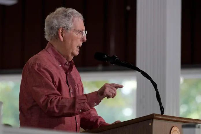 McConnell falls while being questioned by Sunrise Movement protester