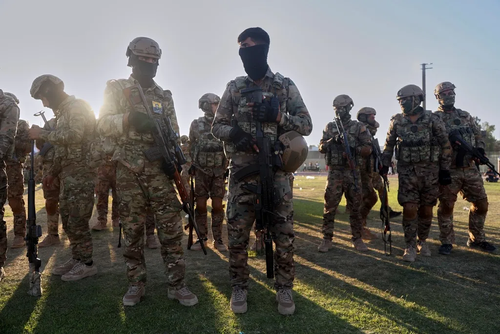 Fighters from the Syrian Democratic Forces prepare to attend a military parade before the funeral of senior Kurdistan Workers' Party leader Nuredin Sofi.
