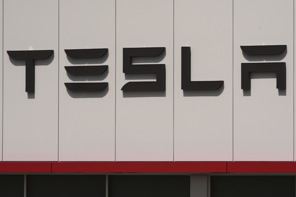 NextImg:Tesla reports record sales increase as EV subsidies expire