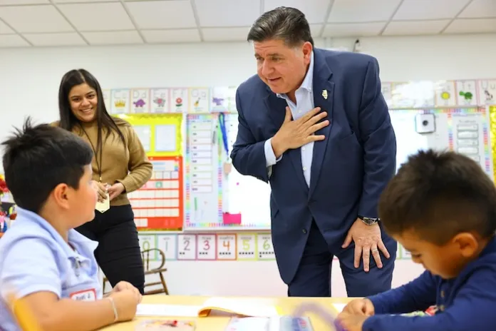 Gov. J.B. Pritzker speaks with kindergarten student at Prairie Oak Elementary School at 1427 Oak Park Ave. in Berwyn, Thursday, Sept. 4, 2025. (Anthony Vazquez/Chicago Sun-Times via AP, Pool)