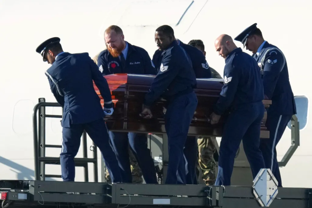 The casket containing the body of Charlie Kirk, the CEO and co-founder of Turning Point USA, who was shot and killed on Sept. 10, 2025, is removed from Air Force Two at Phoenix Sky Harbor International Airport.