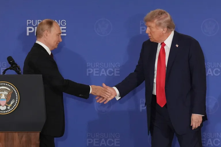 President Donald Trump, right, shakes the hand of Russia's President Vladimir Putin during a joint press conference at Joint Base Elmendorf-Richardson, Alaska, Aug. 15, 2025. (AP Photo/Jae C. Hong, File)