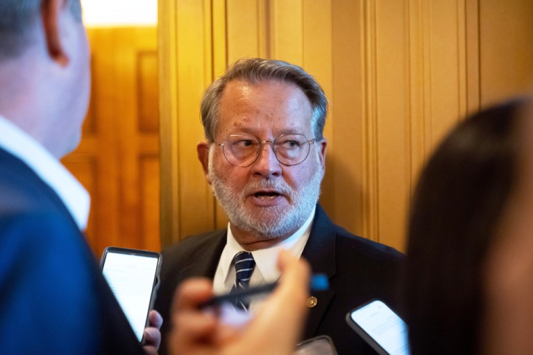 Sen. Gary Peters, D-Mich., speaks to reporters at the Capitol on Wednesday, Oct. 1, 2025, in Washington. (AP Photo/Mark Schiefelbein)