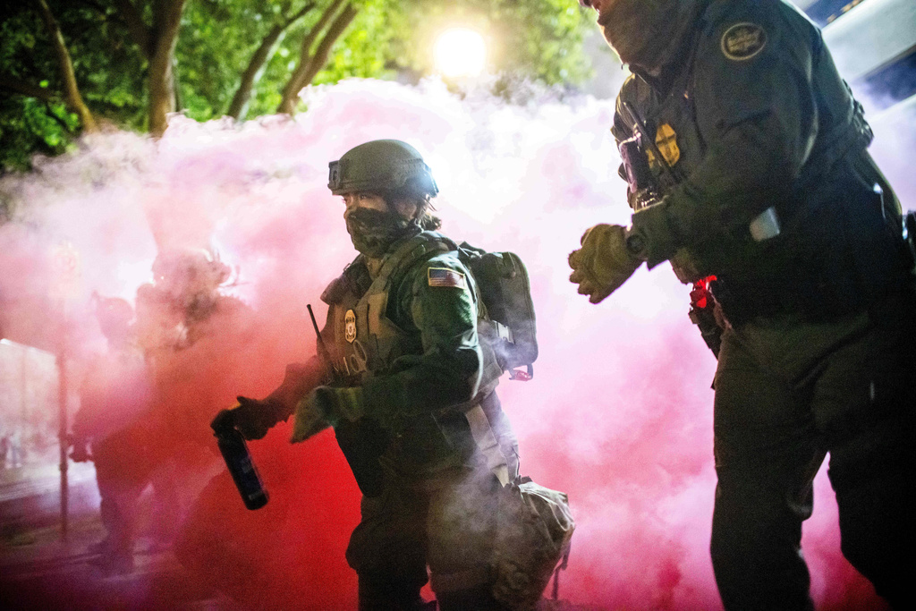 NextImg:Trump open to invoking Insurrection Act after troop deployments