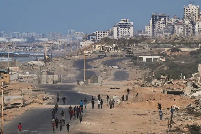 What the timeline of the Gaza peace deal looks like 2 Israeli tanks block the beach road to Gaza City.