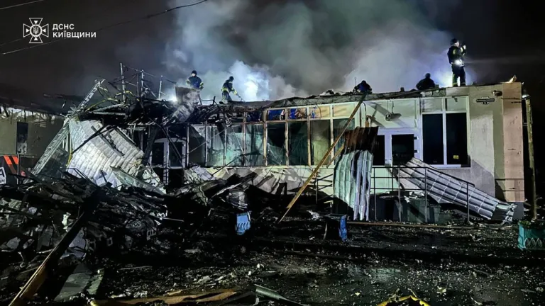 Emergency services personnel work to extinguish a fire.