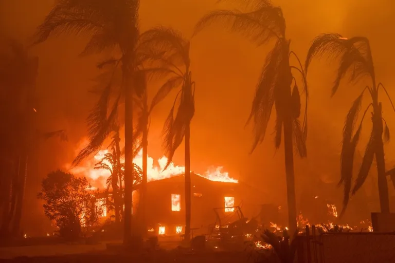 A home burns in the Eaton Fire.
