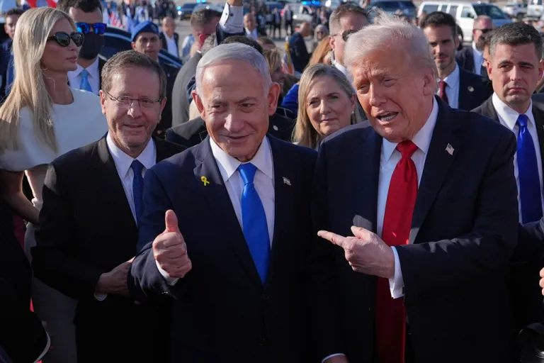 President Donald Trump poses for a photo with Israel's Prime Minister Benjamin Netanyahu before he boards Air Force One at Ben Gurion International Airport, Monday, Oct. 13, 2025, near Tel Aviv, as Israel's President Isaac Herzog, left, watches.