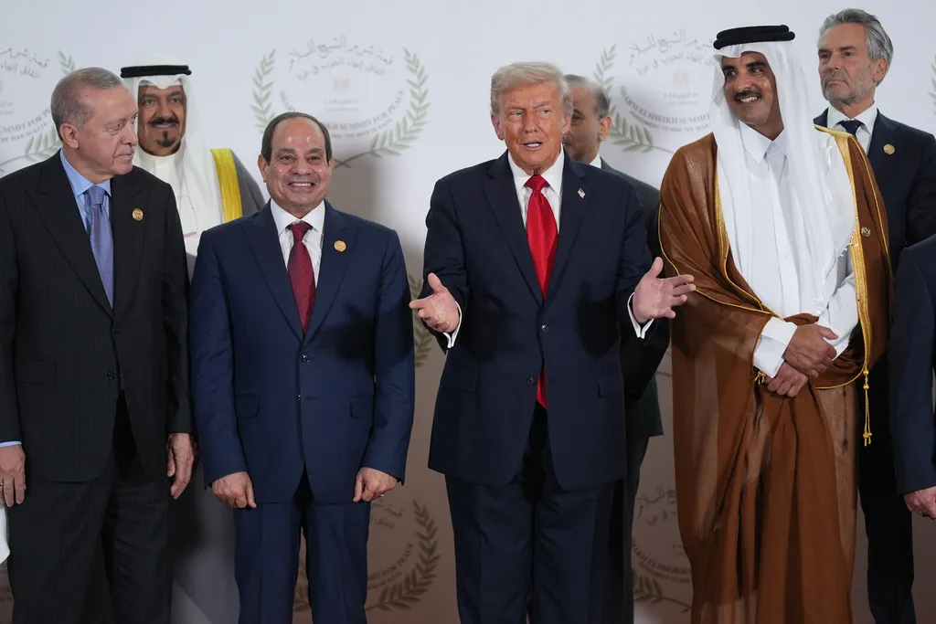 President Donald Trump gestures during a summit to support ending the Israel-Hamas war in Gaza