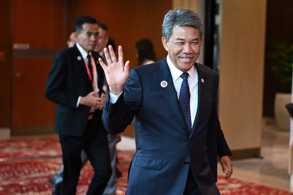 Malaysian Foreign Affairs Minister Mohamad Hasan arrives for the East Asia Summit Foreign Ministers' meeting.