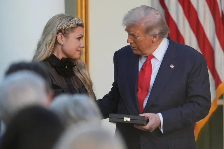 President Donald Trump presents the Presidential Medal of Freedom, to Erika Kirk for her late husband.