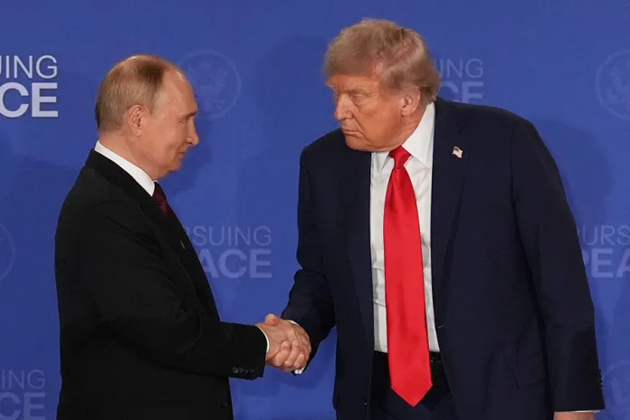President Donald Trump, right, shakes the hand of Russia's President Vladimir Putin during a joint press conference at Joint Base Elmendorf-Richardson, Alaska, Aug. 15, 2025. (AP Photo/Jae C. Hong, File)