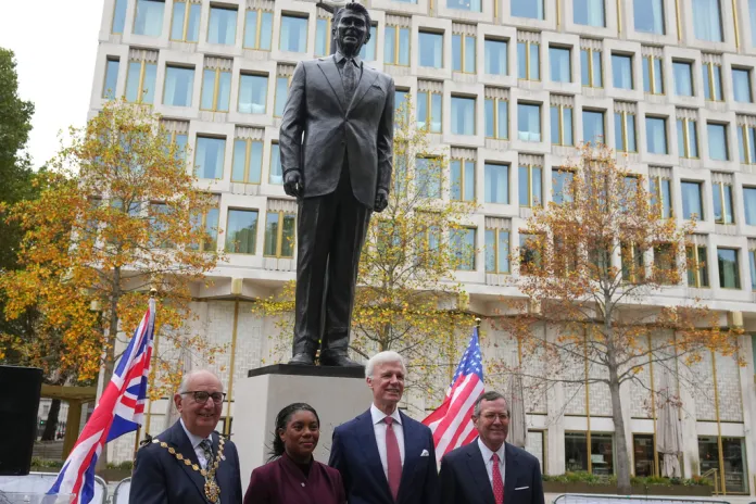 Conservative Party leader Kemi Badenoch, second left, and US ambassador Warren Stephens, right, attend a Ronald Reagan statue re-dedication ceremony honoring the enduring U.S.–U.K. alliance and the Reagan–Thatcher partnership in London, Friday, Oct. 17, 2025. (AP Photo/Frank Augstein)
