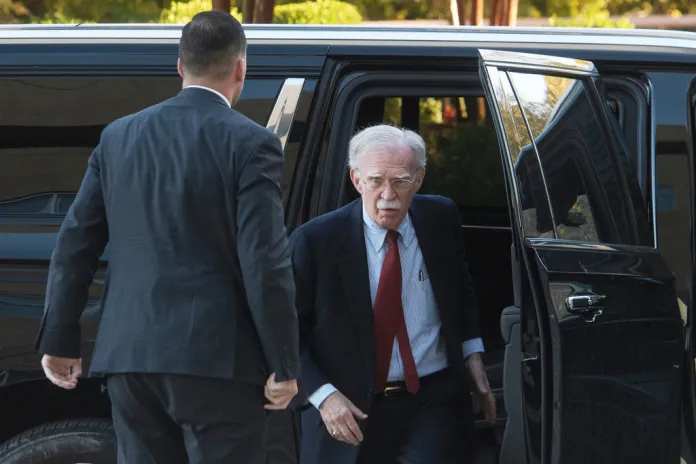 Former Trump administration national security adviser John Bolton arrives for his arraignment