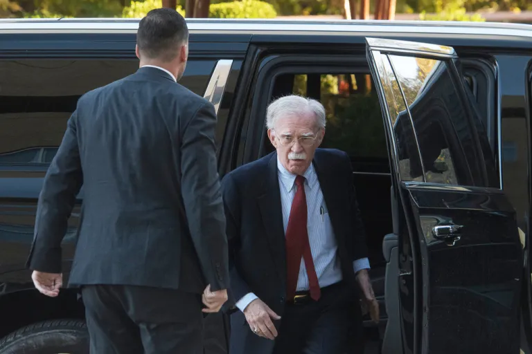 Former Trump administration national security adviser John Bolton arrives for his arraignment