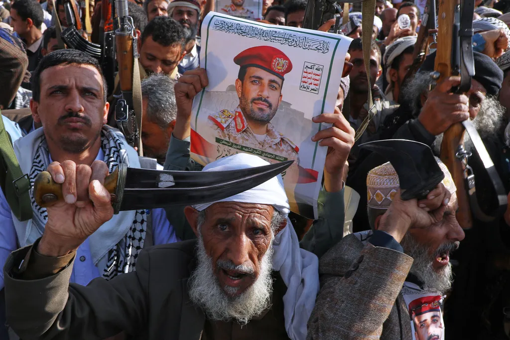 Houthi supporters hold a poster of Maj. Gen. Muhammad Abdul Karim al-Ghamari, who died of wounds he suffered after an Israeli attack, during an anti-U.S. and anti-Israel rally in Sanaa, Yemen, Friday, Oct. 17, 2025.