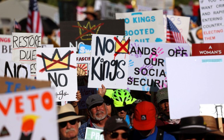 People march with signs during a 