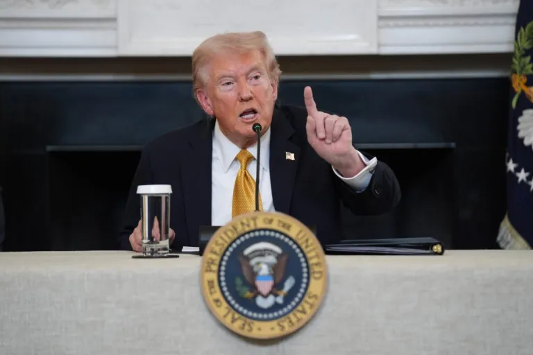 President Donald Trump answers questions from reporters.