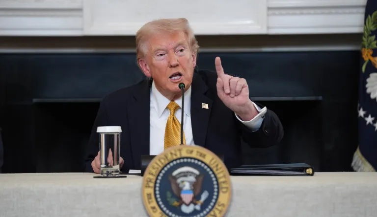 President Donald Trump answers questions from reporters during a roundtable on criminal cartels in the State Dining Room of the White House, Thursday, Oct. 23, 2025, in Washington.