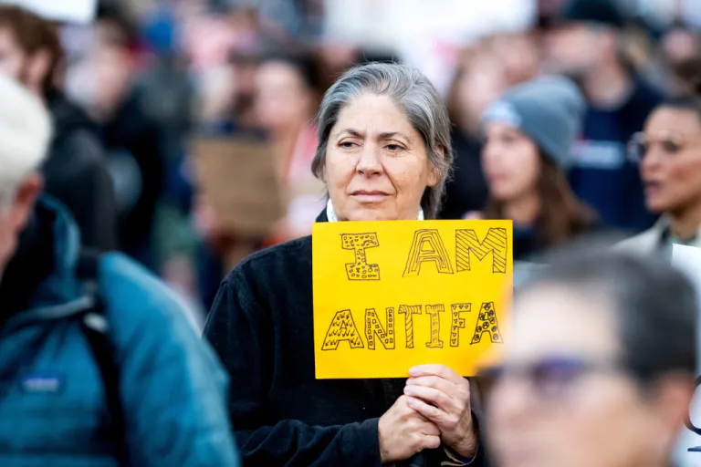 Max Ventura holds a sign reading 
