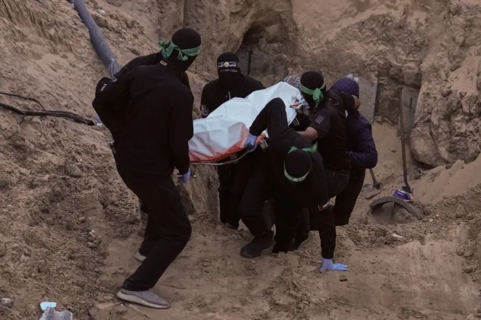 Hamas personnel recover Israeli hostage bodies