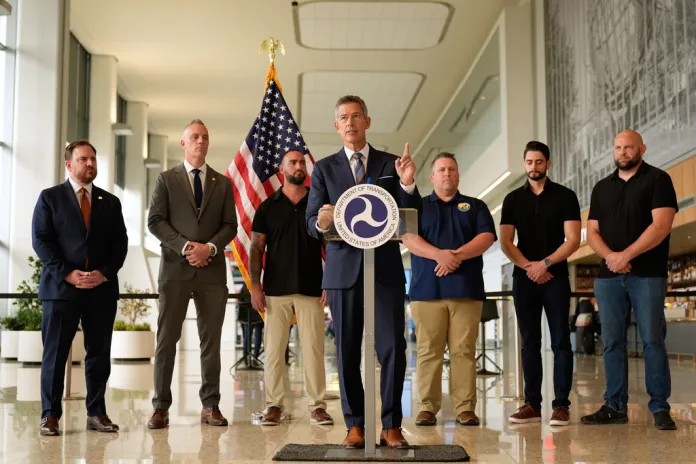 United States Secretary of Transportation Sean Duffy, center, speaks during a news conference at LaGuardia Airport in New York, Tuesday, Oct. 28, 2025. (AP Photo/Seth Wenig)