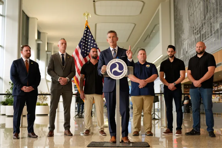 United States Secretary of Transportation Sean Duffy, center, speaks during a news conference at LaGuardia Airport in New York, Tuesday, Oct. 28, 2025. (AP Photo/Seth Wenig)