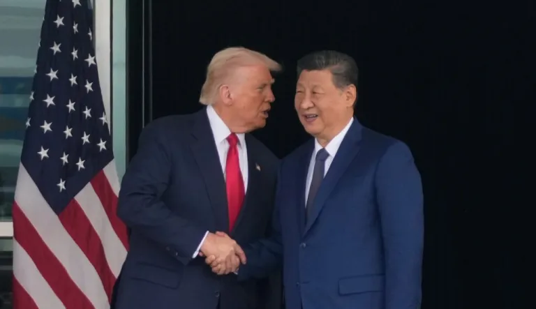 President Donald Trump and Chinese President Xi Jinping shake hands.