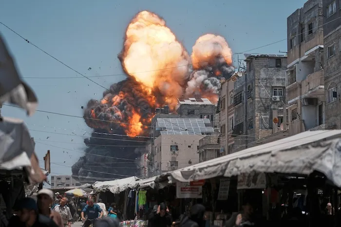 Flames and thick smoke erupt from an Israeli airstrike in Gaza City.