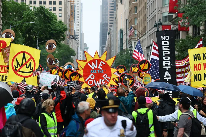 People march in the "No Kings" protest along Fifth Avenue on June 14, 2025 in New York, New York. Hundreds of marches and protests as part of a "national day of peaceful protest" against the Trump administration are happening across the United States today in opposition to his presidency and his policies. The national protest comes as President Donald Trump's military parade celebrating the 250th anniversary of the U.S. Army is taking place in Washington, DC. Today's parade coincides with President Trump's birthday. (Photo by Michael M. Santiago/Getty Images)
