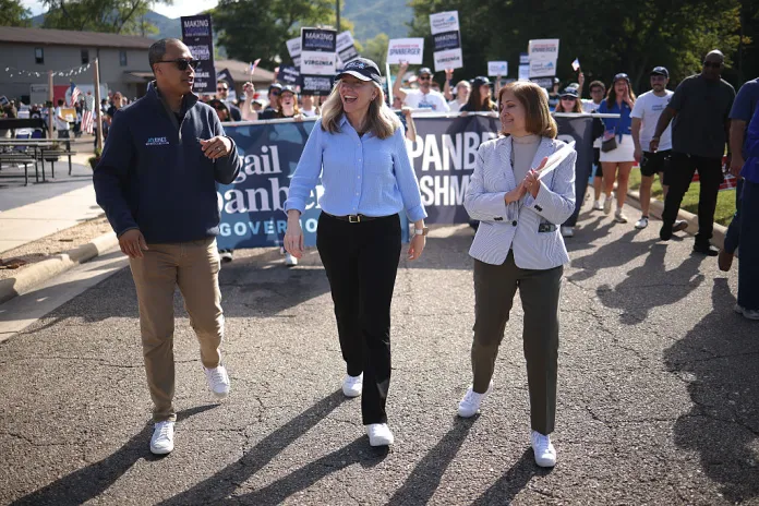 From left, Virginia's Democratic nominee for attorney general Jay Jones, Democratic gubernatorial candidate Abigail Spanberger, and Democratic nominee for lieutenant governor Ghazala Hashmi march in the 54th Annual Buena Vista Labor Day Festival parade.