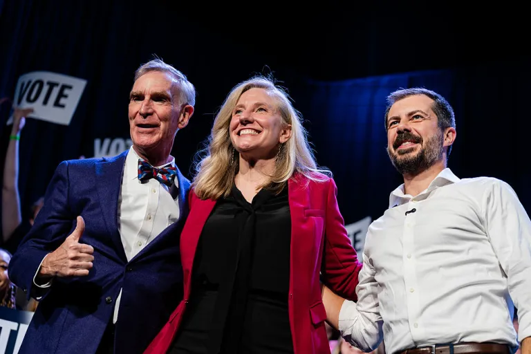Bill Nye, chief executive officer of the Planetary Society, from left, former Representative Abigail Spanberger, Democratic gubernatorial candidate for Virginia, and Pete Buttigieg, former US secretary of transportation, during a campaign event at the Jefferson Theater in Charlottesville, Virginia, US, on Tuesday, Oct. 21, 2025. Spanberger will face off with Winsome Earle-Sears this November, giving the state its first female governor. Photographer: Carlos Bernate/Bloomberg via Getty Images
