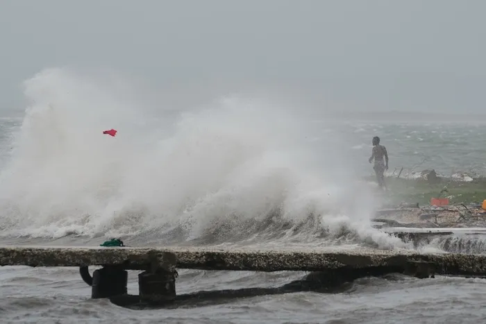Waves splash in Kingston, Jamaica, as Hurricane Melissa approaches, Tuesday, Oct. 28, 2025. (AP Photo/Matias Delacroix)