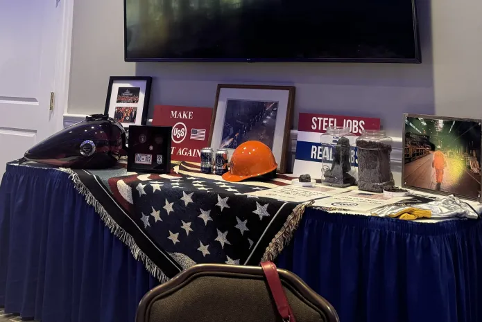 A display of hard hats, flame-retardant overalls, and even coke and steel at a Republican luncheon in Baldwin, Pennsylvania.