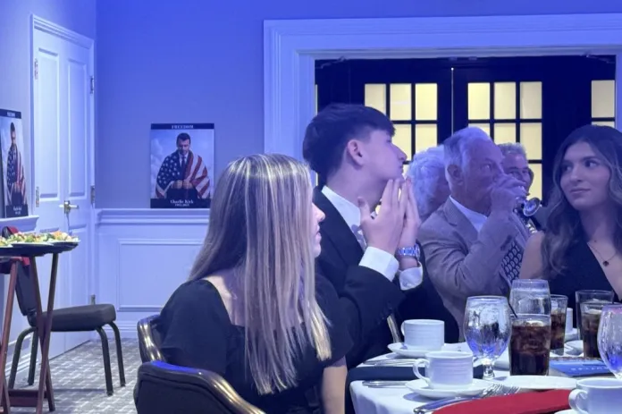 People talk at a table at a Republican luncheon in Baldwin Pennsylvania.