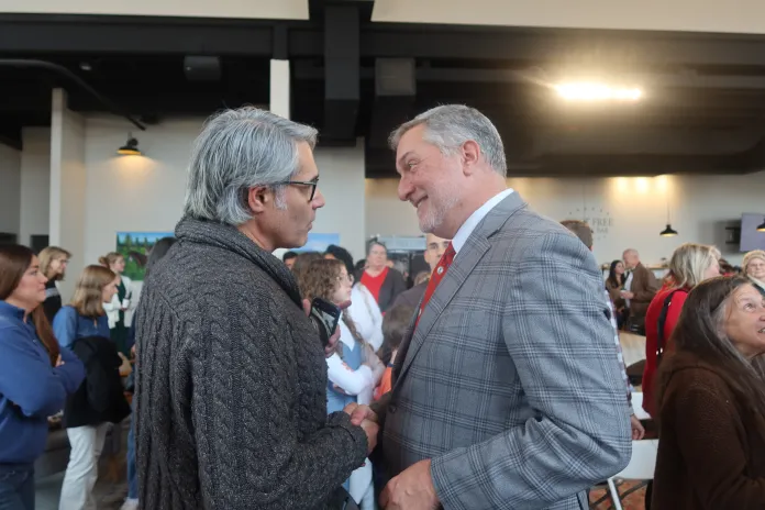 John Reid, who is running alongside Earle-Sears as the GOP’s candidate for lieutenant governor, shakes hands with a voter at a campaign event on Wednesday, Oct. 29, 2025. (Samantha-Jo Roth, Washington Examiner)