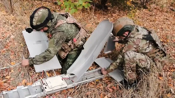 Russian soldiers prepare an FPV drone aircraft "Molniya-2."